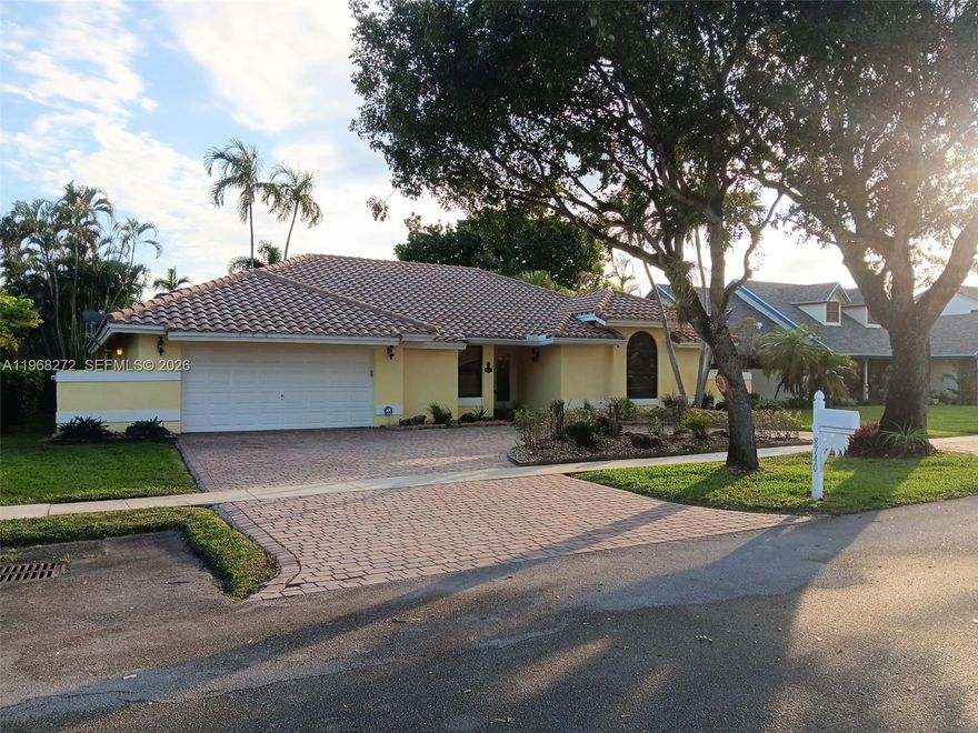 Incredible opportunity to own a rarely available 3BR/2BA + office one-story lakefront pool home showcasing one of the best long water views in the community! Bright, open floor plan ideal for entertaining family and friends. The recently renovated kitchen features quartz countertops, stainless steel appliances, a pantry, and direct views of the pool and lake. The spacious primary suite offers a beautifully remodeled bathroom and a generous walk-in closet. Enjoy true South Florida living from your private backyard with your heated saltwater pool and breathtaking wide lake views — the perfect setting for those picture-perfect bubblegum sunsets. All windows and doors are hurricane proof for peace of mind. Ideally located on a quiet interior street just moments from top-rated Cooper City schools, neighborhood parks, sports fields, and scenic walking paths. Priced to sell!