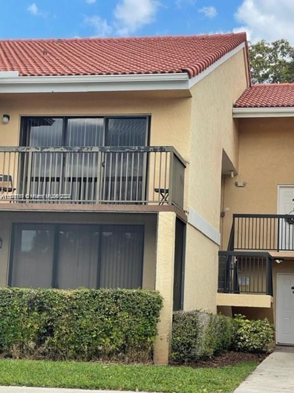 Photo of 5861 Riverside Dr #204A2, Coral Springs, FL 33067 (MLS # A11520189)