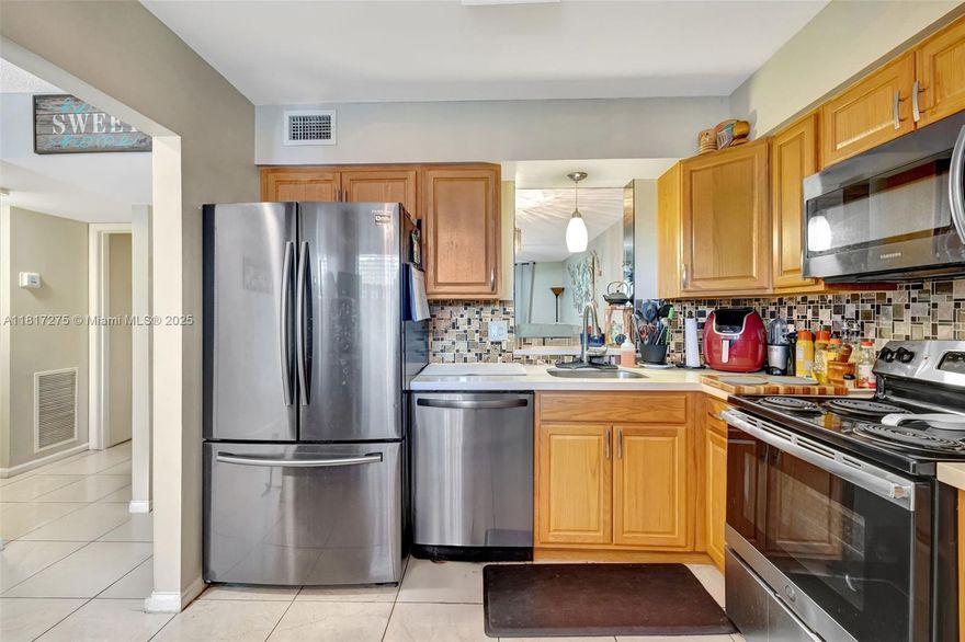 Motivated Seller! Ready to make a deal—bring offers! Palm Lakes updated 2BR/2BA condo. This spacious 1,100 sq ft unit features a renovated kitchen and baths (2019), tile flooring, and a glass-enclosed patio with garden views. Newer appliances (2019) and a 2023 A/C offer peace of mind. Unit includes extra storage and is located on the 4th floor of an elevator building with accordion shutters. Pets allowed (up to 2). Maintenance  includes water, cable, trash, landscaping & more. Close to shops, dining & major roads. One resident must be 55+. No rentals 1st year.