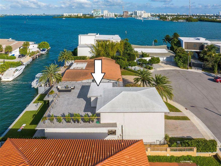 Welcome to your newly renovated waterfront oasis. This 2-story home sits on a quiet cul de sac street that ends where Biscayne Bay begins. The home boasts a large 3,313sf of living space.The first-floor features 3 bedrooms, 2 full baths, and separate guest bathroom.Fully renovated kitchen with custom cascading granite island, countertops and backsplashes, custom cabinets, and brand-new smart appliances. Impact doors and windows. Marble floors throughout. Spacious living room that opens directly to a 65 ft waterfront back yard with new sea wall.The second level Master bedroom features spa bathroom with steam shower and jacuzzi.Connecting media room opens to the newly designed, sprawling roof-top terraces which allow for magical sunset entertainment, or a simple relaxing afternoon/evening.