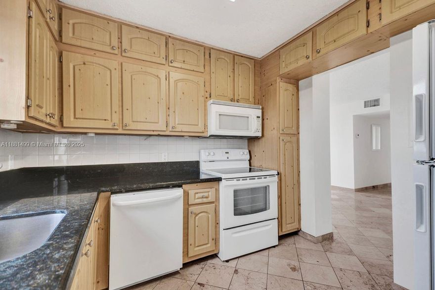 2-bedroom + DEN, 2-bathroom condo features marble tile throughout and kitchen with granite countertops, ample cabinetry and abundant natural light. Enjoy a large balcony, overlooking the tranquil canal. Located just minutes from I-95, the Palmetto Expressway, the Turnpike, Aventura Mall, the beach, and Oleta River State Park, this residence offers convenience and space. Showings by appointment. CASH ONLY.