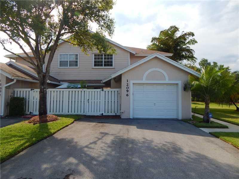 Located in Sunrise Manor West this 3 bedroom 2.5 bath townhome with garage features spacious open floor plan with lots of natural light. Freshly painted interior, newer roof and a/c, neutral tiled floors, berber carpet, kitchen with wood cabinets and larg e breakfast bar. Courtyard in front and patio in back overlooking lush garden area. Centrally located close good schools, shopping, steps away from community pool & block away from Athletic Park.