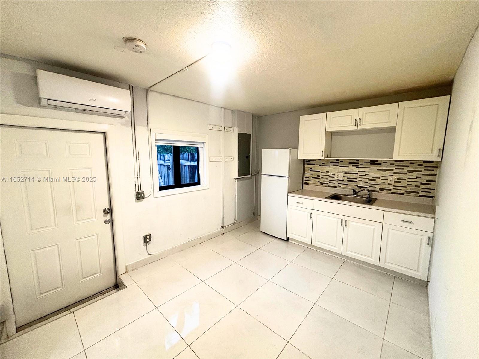 Bright and spacious efficiency with private entrance and one designated parking space. Includes water, electricity, cable, and internet. Features a separate living area, private bedroom, full bath with walk-in shower, refrigerator, and built-in kitchen cabinets. Small pets up to 20 lbs welcome with pet deposit.