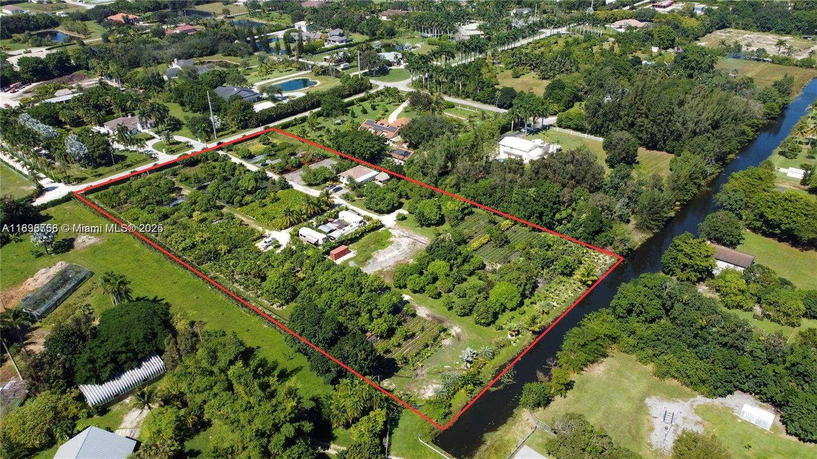 UNBELIEVABLE OPPORTUNITY TO OWN 5 ACRES OF FULLY IRRIGATED LAND FOR LESS THAN $3 MILLION IN SOUTH FLORIDA! This lot will be subdivided (2.5 acres, no house/no trailers LAND ONLY), seller is willing to sell full 5 acres for $2,890,000. This exceptional property is home to a thriving nursery filled with fruit and palm trees, offering great opportunity. The beautifully remodeled 3-bedroom, 2-bathroom home also features a flexible space, perfect for a home office. This property is ideal for expanding an agricultural business, equestrian pursuits, or investment ventures. Whether you’re seeking a peaceful retreat, an income-generating opportunity, or both—this slice of paradise is ready for you. Don’t miss out on this rare find! TWO Parcel Identification Number: 50-39-36-10-0600/59-39-36-10-0590