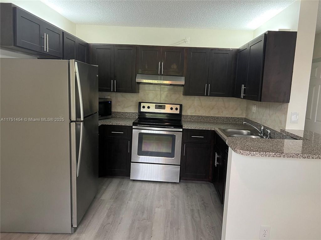 Photo of 11633 Royal Palm Blvd #11633, Coral Springs, FL 33065 (MLS # A11751454)