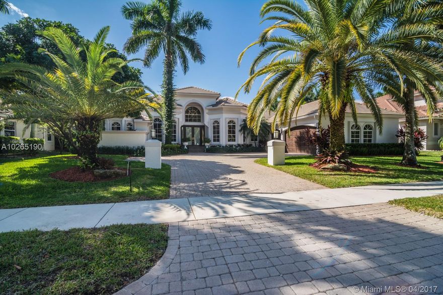 PRICED TO SELL.Step into luxury in this impeccable custom Issa built beauty, completely Turn Key with Contemporary Flair.  Located in the gated community of Weston Hills CC in the desirable neighborhood of Provence. Marble & Wood flooring throughout and designer touches galore. Gourmet kitchen with top of the line appliances, double ovens, center island with large walk in pantry, butler’s pantry. Marble master bath features a soaking tub, dressing area and professionally organized closets. Secondary baths both renovated. Freshly painted in today’s colors. Grand Master bedroom features tray ceilings and wood flooring plus a sitting room. Spacious fully fenced pool backing to the 4th hole of The Players course with no neighbors for ensured privacy.