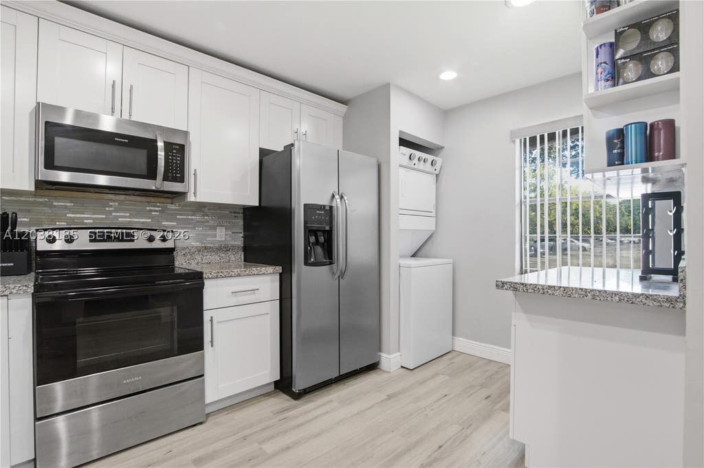 Photo of 2882 Coral Springs Dr #2882, Coral Springs, FL 33065 (MLS # A12038185)