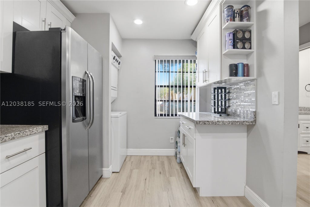 Photo of 2882 Coral Springs Dr #2882, Coral Springs, FL 33065 (MLS # A12038185)