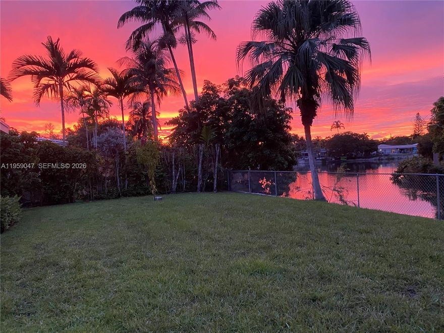 Loved and cared for by one family for over 30 years, this home is ready for its next chapter—an opportunity not to be missed! This charming 4-bedroom, 3-bath residence is nestled along a canal with a private boat dock. Ideal for those who value the peace and quiet of South Miami while enjoying an urban lifestyle, the home is minutes to Trader Joe’s, Aldi, Milam’s, Sunset Place, UM, and Baptist Hospital. Added benefit is a detached 576 sqft. guest cottage with a private entrance and kitchenette—perfect for in-laws, guests, or a college student. Brand new impact windows throughout! Yes, you can even dock a small boat. Come experience the sunset for yourself.