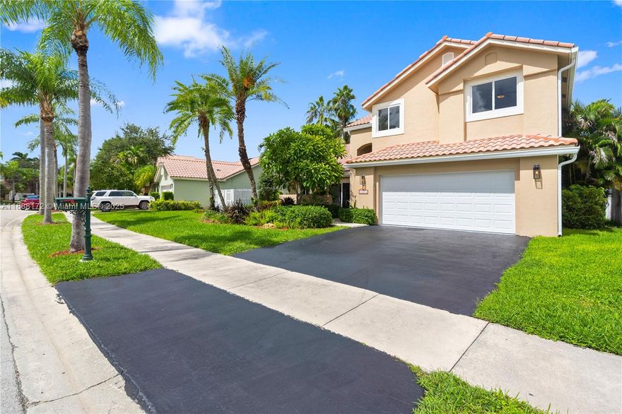 Breathtaking lakefront views frame this renovated Estancia model on an oversized 10,000+ sq ft lot in a gated community. 4BR + den, 3BA with vaulted ceilings and full hurricane protection: impact windows and doors, hurricane-rated entry and garage doors, and accordion shutters. The 2-car garage includes an EV charger; fiber-optic internet keeps everything fast. Interior upgrades feature brand-new appliances (dishwasher, microwave, refrigerator, washer & dryer), with gas range installation included. Outside, enjoy a renewed saltwater pool and spa with updated equipment overlooking the tranquil lake. Top-rated schools and walking distance to the town center.