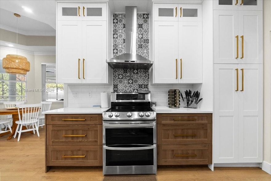 A rare opportunity to own a masterfully renovated estate on 1.2 acres of secluded elegance. This exquisite 4-bedroom, 3-bathroom residence was fully remodeled in 2023, blending timeless sophistication with modern luxury. The interiors are adorned with elegant tile flooring, a designer gourmet kitchen featuring high-end finishes, and curated gold accents throughout—adding a touch of opulence and refined charm.
The expansive living areas are bathed in natural light, creating a seamless flow between indoor and outdoor spaces. Step outside to enjoy a resort-style saltwater pool with a brand-new Diamond Brite finish, surrounded by lush landscaping. The aluminum roof, advanced water system, dual tankless water heaters, and two efficient A/C units ensure lasting comfort and peace of mind.