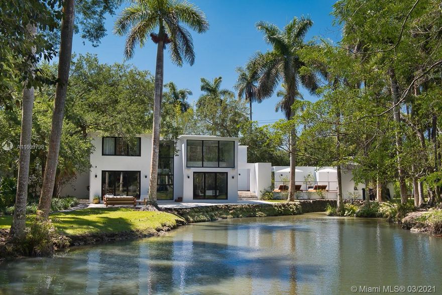 Spectacularly remodeled, this beautiful home is also private and quiet. The gated property is surrounded by lush landscaping, situated on a large lot, and has its own lake. The home features a gourmet kitchen, formal living room with a fireplace, dining room, 2nd-floor kitchenette, luxurious main suite, sparkling pool, outdoor shower, and cabana bath. A 1BR/1BA guest apartment is located above the 2-car garage, and not included in the bedroom count is staff quarters with full bath. This home is truly an oasis, providing the perfect combination for indoor and outdoor living.