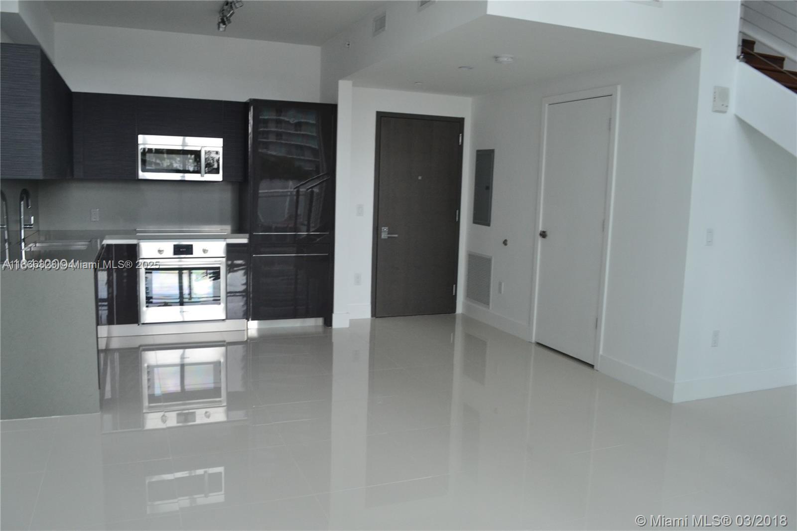 Loft style unit. The Bond on Brickell Avenue at the Financial District. This two level loft unit has a 1 Bedroom and
1.5 Bathrooms for a total of 950 sqft an open balcony facing the city. Unit fixture has European kitchen finish w/
Italkraft kitchen and Bosch appliances. Eggerman brush wood cabinetry along with porcelains fixture bathroom,
assigned parking space in the same level. Amenities included, Resort Pool, Cabanas, Library, Gym and more.