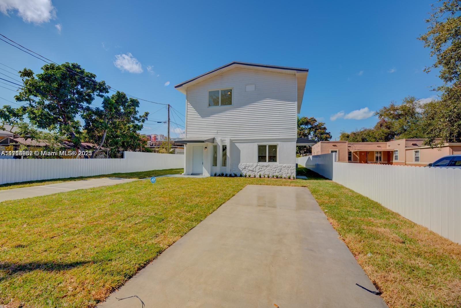 Large 4 bedroom 3 bathroom house, completely remodeled in a central area near shopping and restaurants, with convenient interstate access. Split floor plan with 2 stories offering privacy in bedrooms from main floor. Washer and dryer inside home. Just 10 minutes from Miami International airport. Quiet, family friendly neighborhood, with ample parking space inclusive of two private spaces within gate. This is over 1,500 square feet of living space on a large shared lot (over 8,500 square feet). This home is part of a large DUPLEX with separate and assigned parking with a shared VERY large backyard. This area is rapidly changing and becoming one of the most sought after areas in Miami.