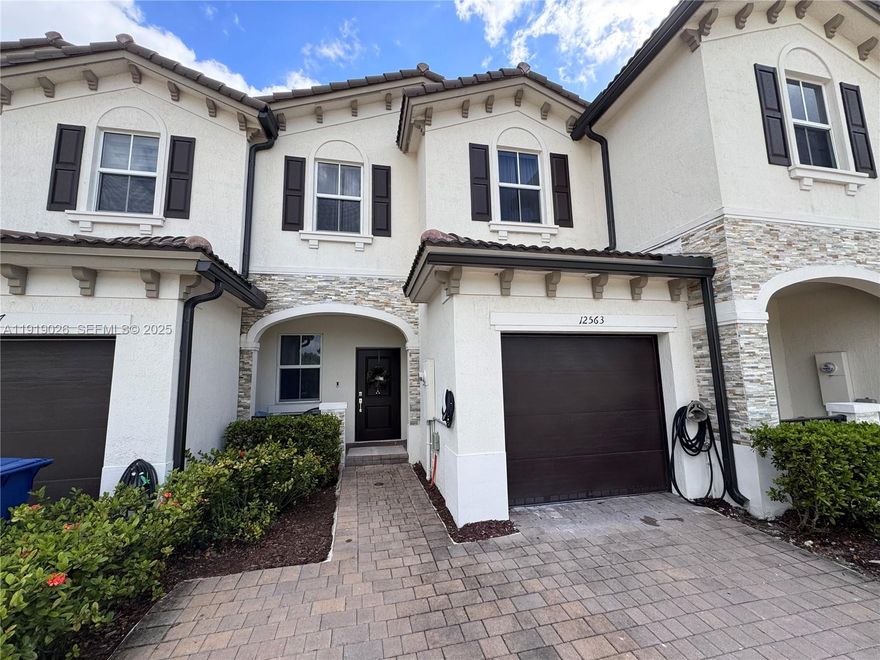 Exceptional opportunity to own a beautifully upgraded townhouse in one of Miami’s fastest-growing and most convenient locations. This residence stands out for its strategic location, modern comfort, and valuable improvements that are hard to find in the area.

The property features premium upgrades, including paver installation in the backyard, porcelain flooring in the garage, and an impressive capacity to park up to 5 vehicles, providing outstanding convenience for homeowners and guests.

Located within a private community offering a resort-style pool, clubhouse, fitness center, playground, and dog park, this home delivers a comfortable lifestyle with low maintenance and excellent amenities.

Its central location provides unmatched accessibility:
 • 15 minutes to Miami International Airport
 • 25 minutes to Fort Lauderdale International Airport
 • 4 minutes to Miami Dade College – North Campus
 • Close to major shopping centers, supermarkets, and reputable schools.

This is a rare opportunity to secure a move-in-ready property in a high-demand area.
Easy to show — schedule your appointment today.