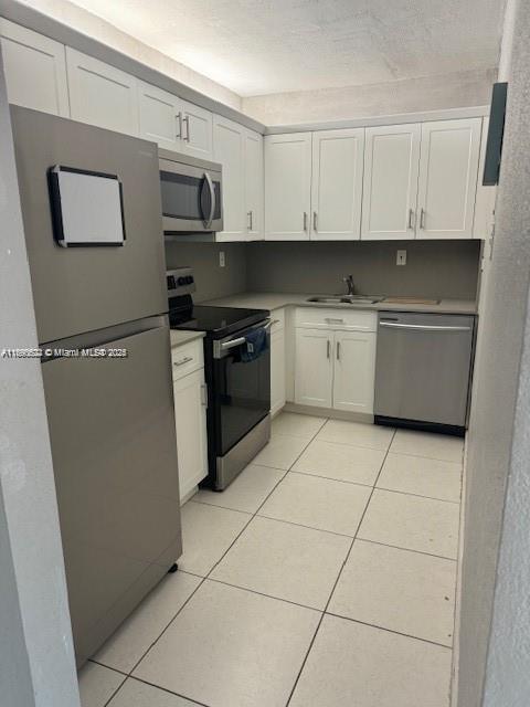 This spacious condo features brand new kitchen cabinetry with stainless steel appliances and tile floors. It includes (1) assigned parking space and limited guest parking available. The complex is located near highways, malls and restaurants. Condo features impact windows.
