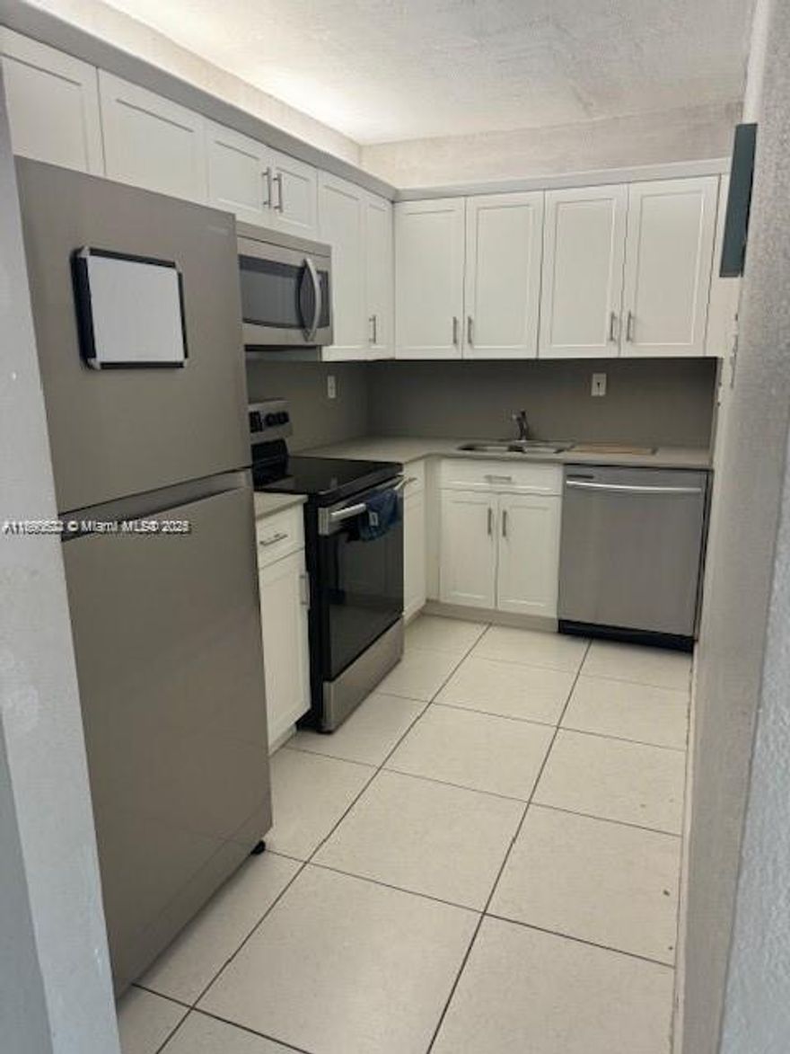 This spacious condo features brand new kitchen cabinetry with stainless steel appliances and tile floors. It includes (1) assigned parking space and limited guest parking available. The complex is located near highways, malls and restaurants. Condo features impact windows.