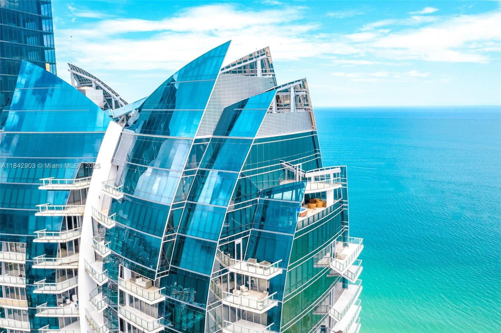 Luxuriate in this fully renovated 8,332 sqft Penthouse in Sunny Isles with direct ocean views. Featuring 6 bedrooms, 7.5 bathrooms, private elevator, gym, sauna, media room, and 2000 sqft of terraces with each room offering a private terrace. Meticulously furnished with top-of-the-line RH furniture, this mansion in the sky is a true masterpiece. The owner spent $2M on renovations. Experience ultimate luxury living in this exclusive retreat. PH 4803 is the ultimate home in the sky with breathtaking 360-degree views of the ocean, downtown Miami and the inter coastal. Jade Ocean amenities include 2 pools, beach service, children's playroom, business center, spa, fitness center, concierge, valet, and doorman.