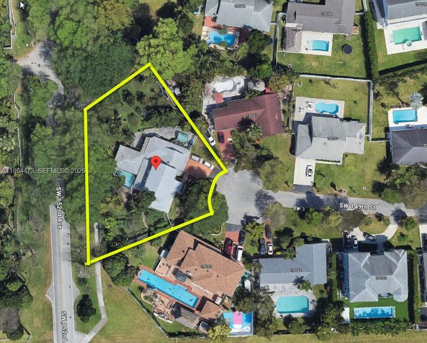 Seller offering $20,000 towards closing! Discover this stunning 5,691 sq ft custom estate (4,839 under air) on the largest 0.61-acre lot in Country Walk Estates. Nestled on a serene cul-de-sac, this 5-bedroom, 4.5-bath home blends luxury and tranquility. 

Beautiful marble floors flow throughout, leading to a grand covered patio with a tranquil koi pond, ideal for entertaining. Enjoy a fully equipped outdoor kitchen, home theater, and lush tropical fruit orchard. The entire second floor is a lavish owner’s suite with a massive bedroom-sized closet. 

This gem in a premier community offers the chance to update and personalize, or just add a sparkling pool. Perfect for hosting or relaxing in style, this estate is a true sanctuary. Schedule a tour today. Owner motivated!