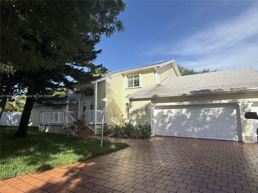 Seller offering $20,000 towards closing! Discover this stunning 5,691 sq ft custom estate (4,839 under air) on the largest 0.61-acre lot in Country Walk Estates. Nestled on a serene cul-de-sac, this 5-bedroom, 4.5-bath home blends luxury and tranquility. 

Beautiful marble floors flow throughout, leading to a grand covered patio with a tranquil koi pond, ideal for entertaining. Enjoy a fully equipped outdoor kitchen, home theater, and lush tropical fruit orchard. The entire second floor is a lavish owner’s suite with a massive bedroom-sized closet. 

This gem in a premier community offers the chance to update and personalize, or just add a sparkling pool. Perfect for hosting or relaxing in style, this estate is a true sanctuary. Schedule a tour today. Owner motivated!