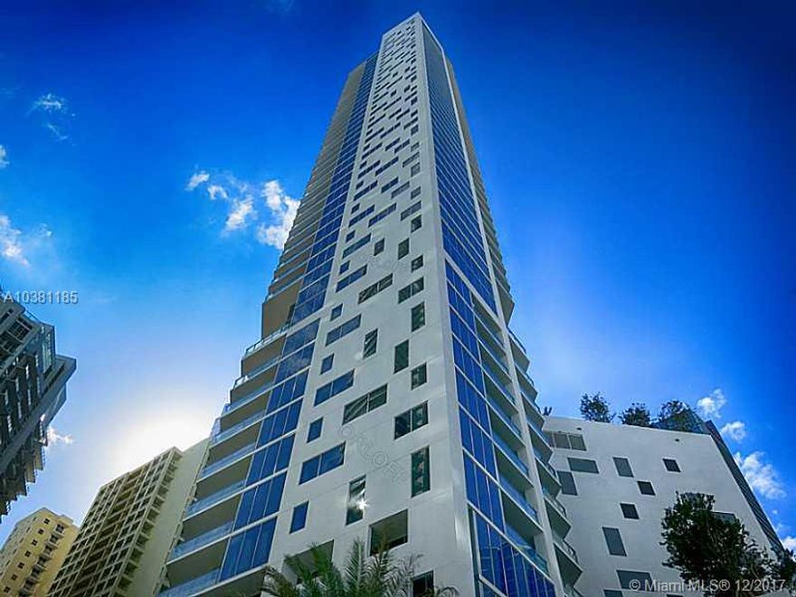 FIRM PRICE. Spectacular studio with tile floors. Living room steps out onto glass balcony with SE exposure and bay views. Owner requires first, last & security. Association requires one month common area deposit. No pets. One year leases only. Per owner, price is firm, only full price offers with an escrow letter will be considered. Robotic parking system is closed until further notice with off-site valet parking provided by association. Please contact association for most up to date details of current status and alternate arrangements.
