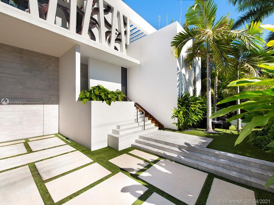 Inspired by a Boheme Design, this marvelous waterfront home sits on an extra-large 12,250 SF lot with spectacular wide bay views to the north including warm, yet modern interiors. This home is truly a form of public art, featuring a living room with vaulted ceilings, a spacious master suite and a large marble bath. Amenities include a large entertaining area surrounding an oversized pool and a new boat dock with lift. Enjoy unobstructed views of Miami and Miami Beach skylines!