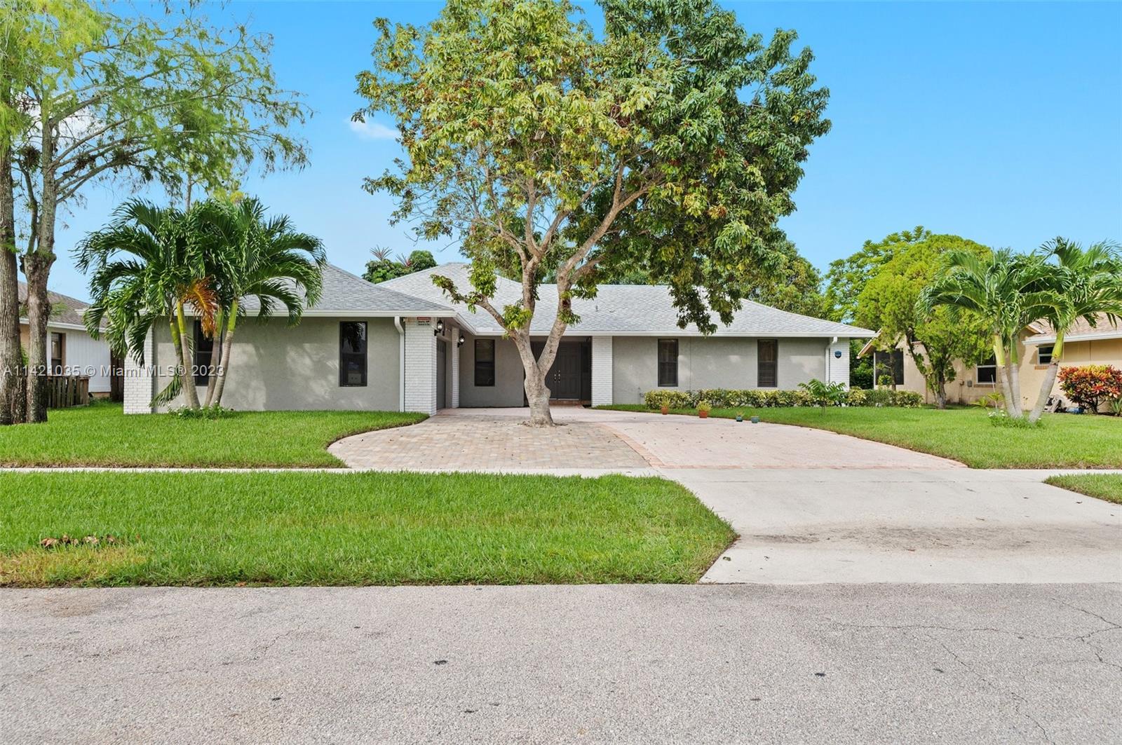 This home is picture perfect! Tastefully decorated & upgraded from the minute you drive up to the house. Great curb appeal! Exterior has newly installed seamless gutters, newer roof installed in 2021 and an expanded driveway. Walk into this immaculate home and notice all the updates, brand new designer light fixtures, smooth finish walls and ceilings and a recently updated kitchen, plus all updated bathrooms and a newly installed water filtration system. Tile floors throughout and wood laminate floors in the bedrooms. The biggest bonus of this home is a 380 square foot bonus/recreation room!! Property also has a fenced backyard and mature fruit trees. This stunning home is also located near premier Wellington equestrian facilities. Don’t miss out!!
