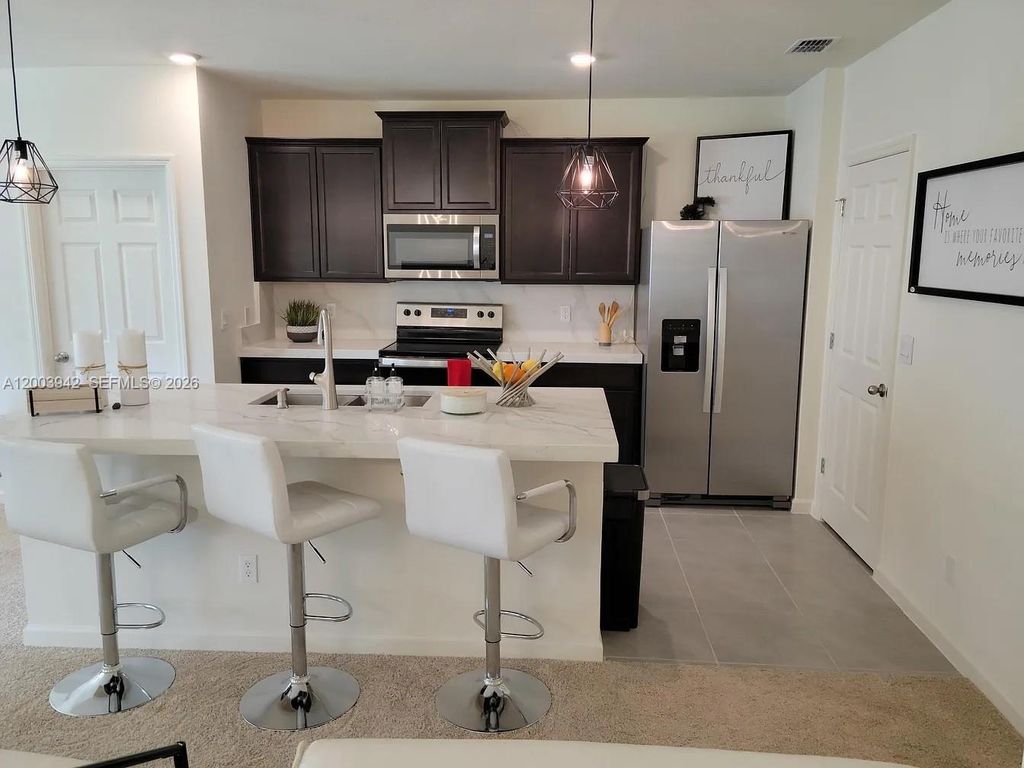 Photo of 5517 Amusement Ave, Fort Pierce, FL 34947 (MLS # A12003942)