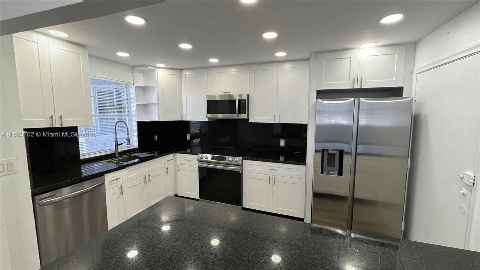 Easy to show ! Ready to move in ! Incredibly opportunity for spacious 2/2 corner unit in the most desirable area of Meridian Ave. Completely remodeled, with new Impact Windows!!!! new bathrooms, new air conditioning, new kitchen, new electrical panel, all with permits. Bright corner unit with tons of natural light/large terrace over looking the pool- large main bedroom with en-suite bath-walk in closet. Designated storage unit- Pool, assigned parking & bicycle storage Steps to beautiful Flamingo park with it beautiful tennis courts, swimming pool, basketball, and children's playground. Embrace the South Beach lifestyle in this spacious unit. The community has completed its 40-year recertification.