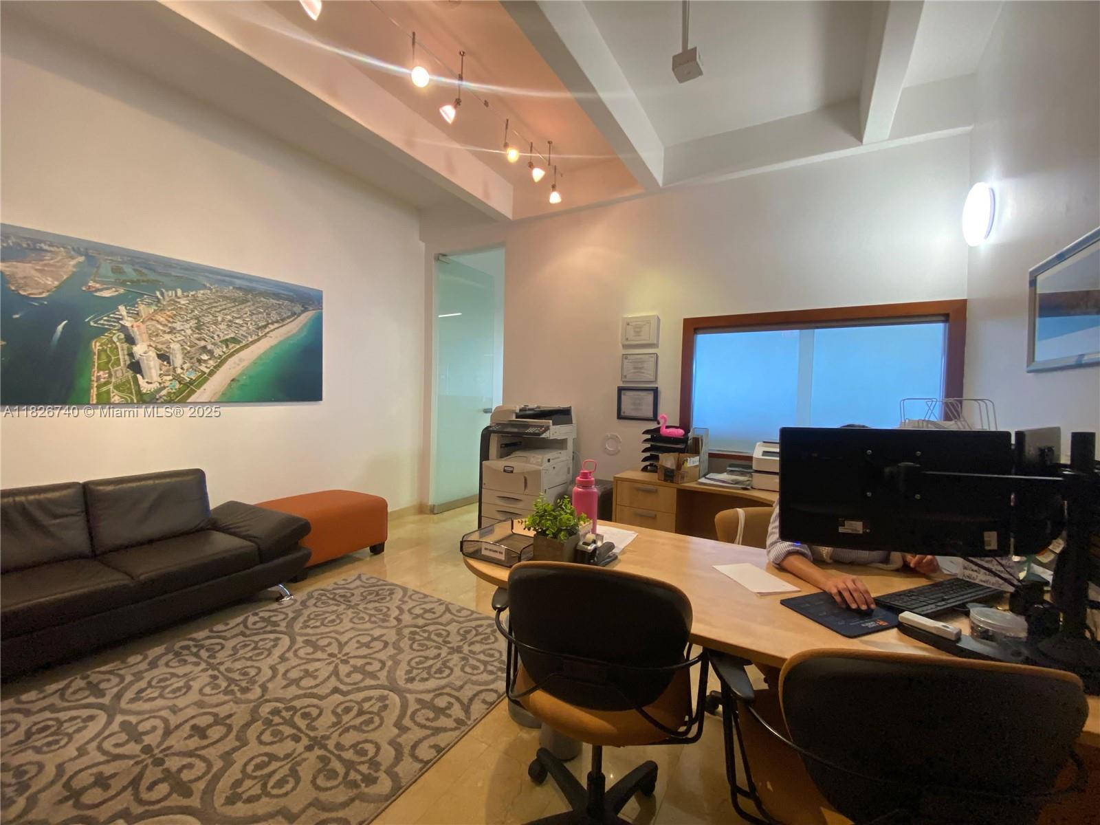 Discover a bright and efficient office space at 1680 Michigan Avenue, Units 1014A & 1014B, offering a combined 1,004 SF of functional layout in a Class A building just steps from Lincoln Road. Featuring 9’ to 10’ high ceilings, this suite is designed for both professionalism and comfort.
The layout includes a welcoming reception area, a private conference room, and an open workspace ideal for a range of business types. Enjoy the convenience of full-service leasing (minus janitorial), with AC maintenance, water, and electricity all included in the rent.