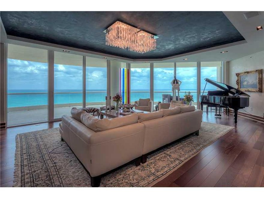 Elegant high amenity living! Spectacular ocean views abound in this NE corner custom designed luxury unit. Exquisite design features include grand foyer entrance w/private elevator, Brazilian hardwood floors, custom designed doors, built-in furnishings, V enetian plaster walls, tray ceilings. 4 bed/6.5 baths plus staff room. Bedrooms #3 converted to office, #4 converted to media room, may be converted back to bedrooms. Crestron Technology System & Lutron  Lighting. Sold unfurnished. Built-ins included.