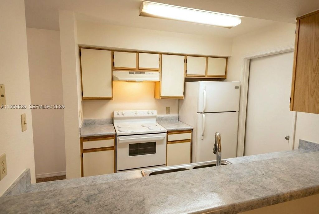Photo of 2420 NW 33rd St #1011, Oakland Park, FL 33309 (MLS # A11959528)