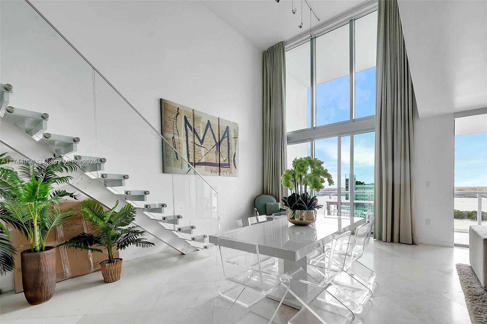 Spectacular 2 story penthouse. Unique architectural masterpiece of 4 bedrooms, 3.5 bathrooms, large boudoir, powder room, 22 foot ceiling, floating glass staircase. Recently renovated by a renowned architect, high-end kitchen and dream built-in closets. Floor to ceiling glass impact windows.... throughout with views of the Ocean, Intercostal, Indian Creek, South Pointe, Sunny Isles, Biscayne Bay... Building offers state of the art amenities including a waterfront swimming pool & jacuzzi, fitness center, tennis and basketball court, private marina and 24/7 concierge & security. Must see!