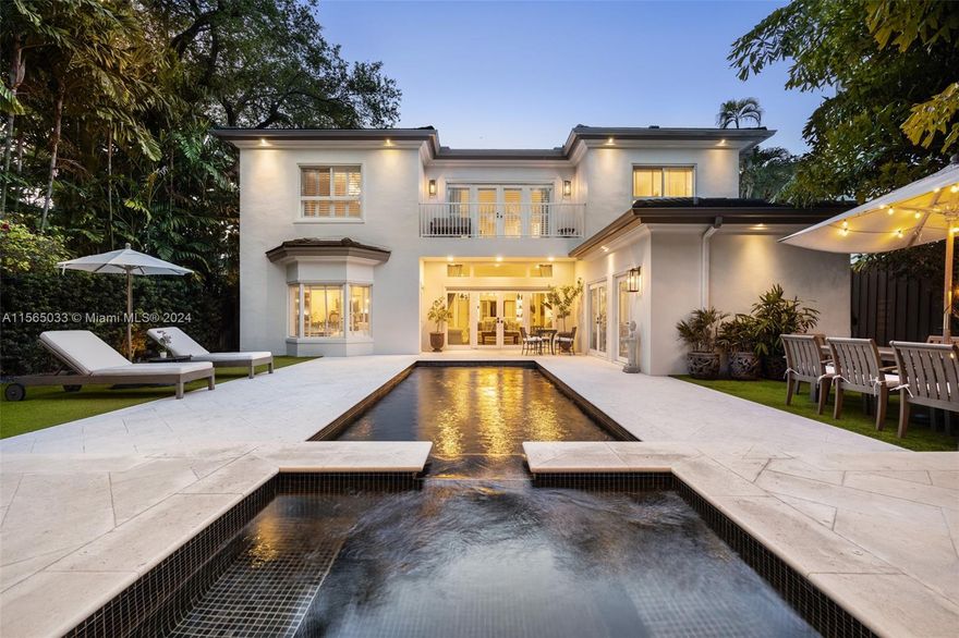 Tastefully renovated and impeccably maintained 5 bed 5.5 bath home in coveted South Grove. Fully gated with an oversized two car garage and additional car-port with a backyard oasis that includes a covered terrace, summer kitchen, jacuzzi, and a heated pool. Home features include stunning kitchen cabinetry, marble counter, wolf gas range & subzero fridge, wine cooler, and a kitchen island. The first level includes a formal living/dining & spacious family room with pool views, + office, + guest bed (ensuite), and a maid's bed & bath. The second level includes 3 bed (all ensuite), including a primary bed with a balcony, a walk-in closet, and a spa-like bath with marble finishes, dual sinks, and a  bathtub. Minutes to the Grove village and walking distance to Ransom  and Carrollton schools.