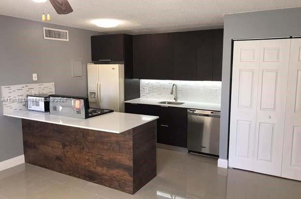 Photo of 637 Executive Center Dr #N107, West Palm Beach, FL 33401 (MLS # A11968538)