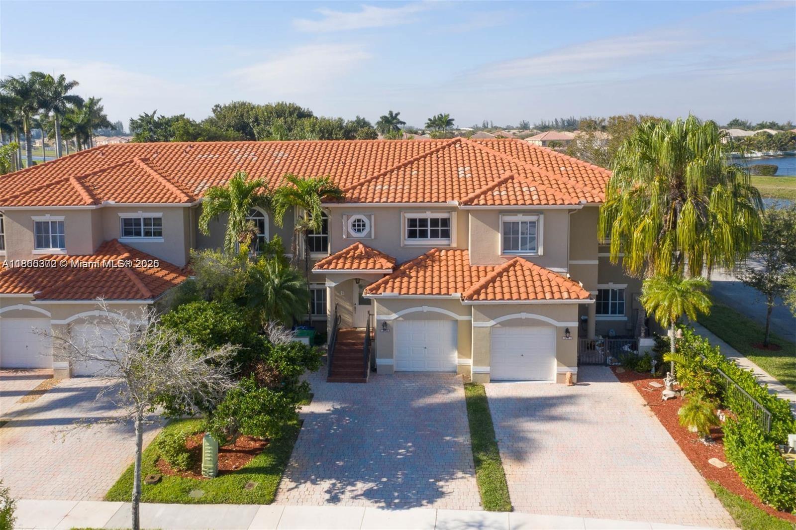 Beautifully updated 3 bed, 2.5 bath very spacious townhouse in a prestigious man-gated community of Somerset Cove at Vizcaya! Former model home with a better layout and a massive private patio—3–4x larger than other units, no backyard neighbors and a canal view. New roof & A/C (2023), freshly painted (2024), full accordion shutters, and hurricane-impact Florida room sliders. Bright, open concept kitchen layout with stainless steel appliances and spacious living areas with lots of natural light. Laminate flooring throughout the entire home. Very large bedrooms with big closet spaces and walk in closets. One-car garage with extra storage. Just steps from the pool! Community offers 24/7 security, pool, and playground. Close to A rated schools, shopping, and highways. Move-in ready!