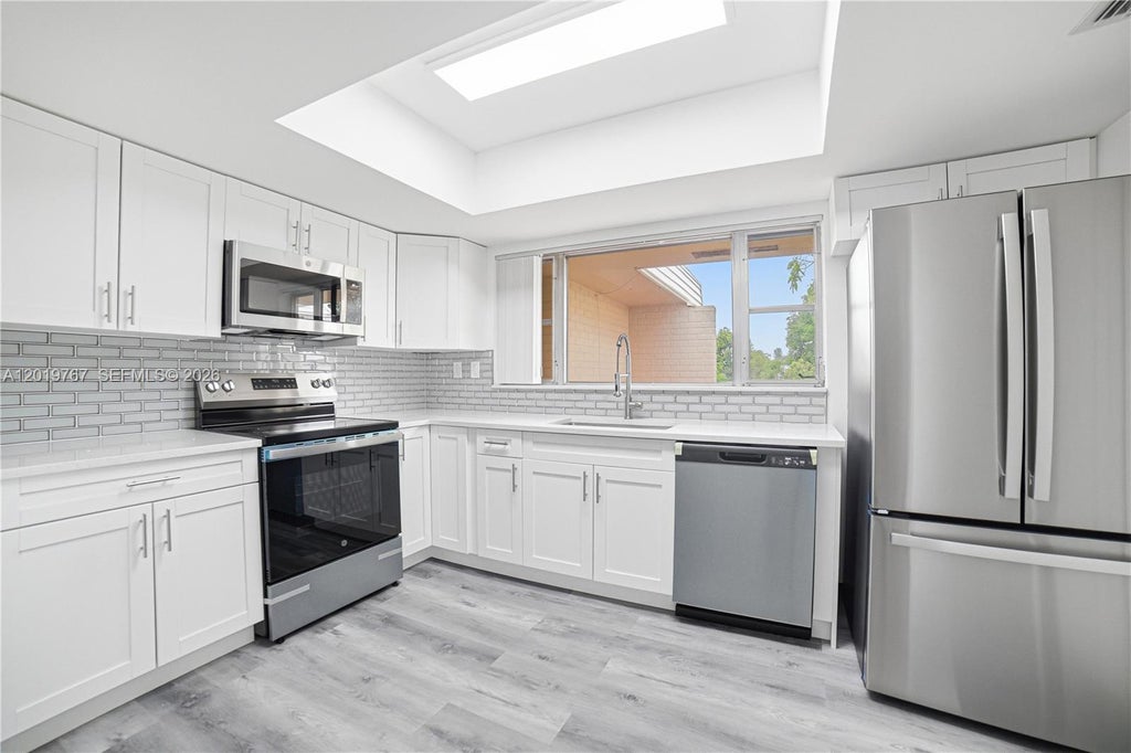 Photo of 5201 Yellow Pine Ln #0, Tamarac, FL 33319 (MLS # A12019767)