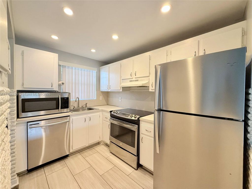 Photo of 1638 Embassy Dr #212, West Palm Beach, FL 33401 (MLS # A11758750)