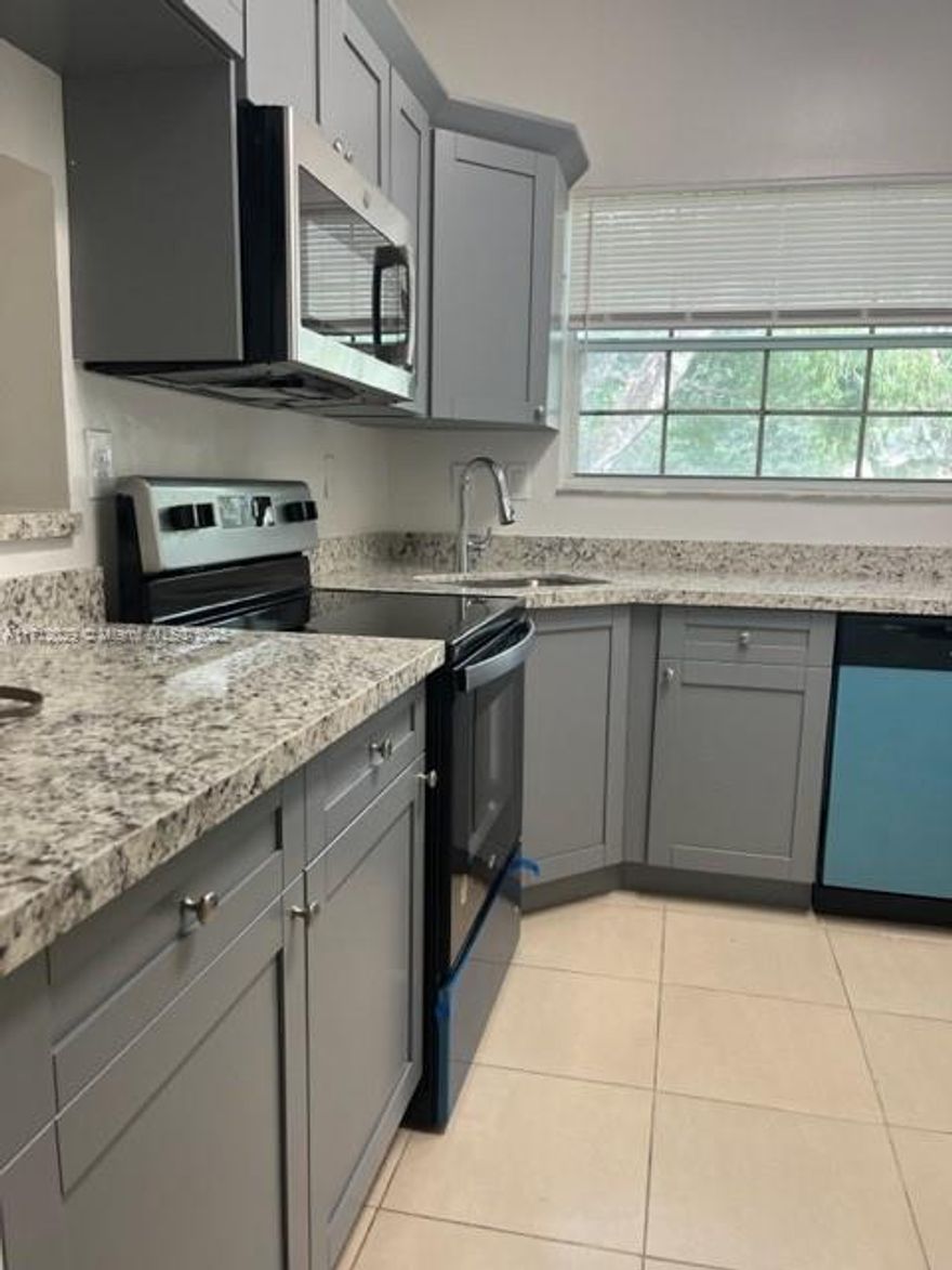 Nice Condo at Reflections at Pembroke Pines. 2 Bed/2 Bath with a beautiful " lake view " Newer Kitchen Cabinets with Granite Counter Tops.  Newer Appliances. Newer Water Heater, Tile floors.  Washer and Dryer inside the unit. Storage. Amenities include Pool with Jacuzzi, Tennis Courts. Tennis Courts, Racquetball Courts, and Basketball. Great location near Shopping Centers, Restaurants and Schools.  Easy to Show.