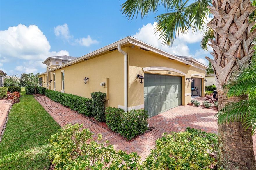 Beautifull Villa in LakePark at Tradition, the desirable 55+ Gated community, designed for relaxed yet vibrant living. Built in 2019, with a total of 2218 sf, 2 bedrooms, 2 bathrooms + a den/office that can easily be converted into a 3rd bedroom if desired. A spacious primary suite with a large walk-in closet, dual sinks, and a walk-in shower. Also features a Relaxing Screened Lanai, Volume Ceilings, Impact Windows & doors, laundry room & a 2-Car Garage. Enjoy access to two clubhouse complexes, pool, gym, tennis, pickleball, and basketball courts, dog park & more. Golf Cart-Friendly community for added ease & fun. Centrally located near shopping, restaurants, beaches & hospitals. HOA fee covers cable, alarm, Wi-Fi, lawn care, pest control, & tree trimming. Easy to show.
