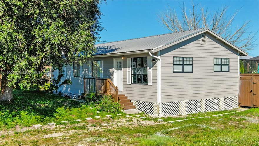 Welcome to your dream home in the heart of Lehigh Acres, conveniently located near Sunshine Blvd! This cozy wood home boasts four bedrooms and two bathrooms, ensuring ample space for family and guests. The apartment at the back offers potential income opportunities, making it perfect for those looking to invest. You'll fall in love with the newly upgraded kitchen, a culinary enthusiast's paradise, equipped with stainless steel appliances. The exterior has been freshly painted, giving the home a crisp and inviting curb appeal. Don't miss your chance to own this charming property that combines comfort, style, and convenience!