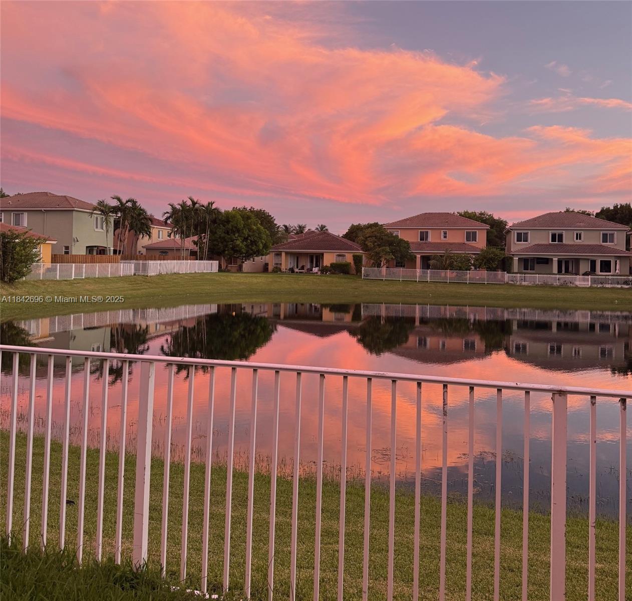 Rarely available lakefront home in the highly sought-after Cantamar community! This 4-bedroom, 2-bathroom residence offers stunning lake views from the moment you enter, visible from the foyer, living room, dining room, kitchen, family room, and primary bedroom. Features include high ceilings, a spacious split-bedroom layout, one-car garage, eat-in kitchen with ample cabinetry, accordion shutters, and a beautifully maintained interior. The fully fenced backyard with lush privacy hedges enhances the lakefront living experience. Cantamar is known for its tree-lined streets and pride of ownership throughout. Easy to show, contact listing agent for details.