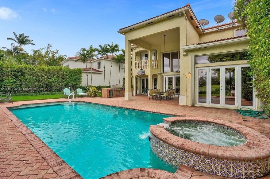 Presidential Estates, highly desirable Garland model perfectly located on a rare oversized 12,487sqft lot w/ beautiful lake & garden views. This impeccable 5 bed 5.5 bath 4220sqft home offers may upgrades including marble & wood floors, kitchen w/gas cooking, a center island w/a full size additional sink, opened living room w/volume ceilings, huge built-in master closet, master steam shower w/double shower heads & jets, an expanded driveway w/ finished 2 car garage, an electric car charger, an oversized backyard patio w/a custom 6ft deep extra-large pool w/spa, custom built-in summer kitchen & plenty of room for backyard entertaining on the expansive lot. Feel at ease w/hurricane shutters & 35 KW Generec Nema generator! Call today.