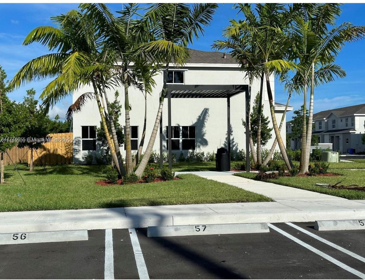 Don't Wait! Don't Miss Out on this beautiful 3-bed, 2.5-bath townhouse, features stunning tile floors, sleek stainless steel appliances, and a fenced backyard perfect for entertainment. One block away from Florida Outlet Mall. close to the Florida Turnpike.