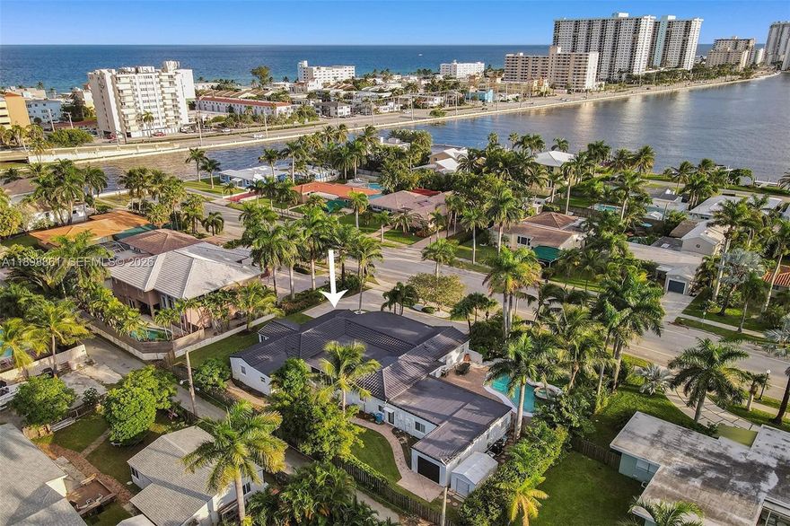 Embrace the best of coastal living in this bright and spacious 7-bedroom, 5-bath home, ideally located just a short walk from Hollywood Beach and the Intracoastal. Set on one of Hollywood’s most desirable streets, this 1953 gem offers 4,197 sq ft of living space on an oversized 18,040 sq ft lot. Inside, enjoy sun-filled interiors, sleek modern bathrooms, warm wood flooring, and a versatile Florida room perfect for relaxing or entertaining. With its generous layout and expansive yard ready for your dream outdoor oasis, this property combines timeless charm, space, and an unbeatable location.