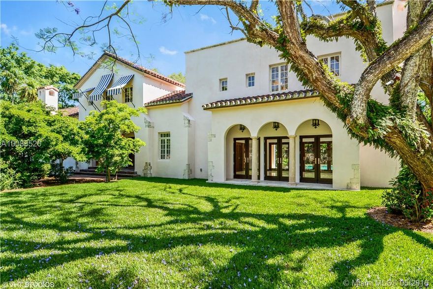 This grand Spanish-revival residence hidden behind a magnificent coral rock wall on secluded 3/4 acres is located in one of Coconut Grove most prestigious neighborhoods. Elegant estate was meticulously restored to retain its old world accent and original architectural integrity. Lush landmark surrounds a stunning pool and sunken garden created million years ago from marine limestone that varies in elevations and is seamlessly enhanced by professional landscaping. Just few yards from the ocean.