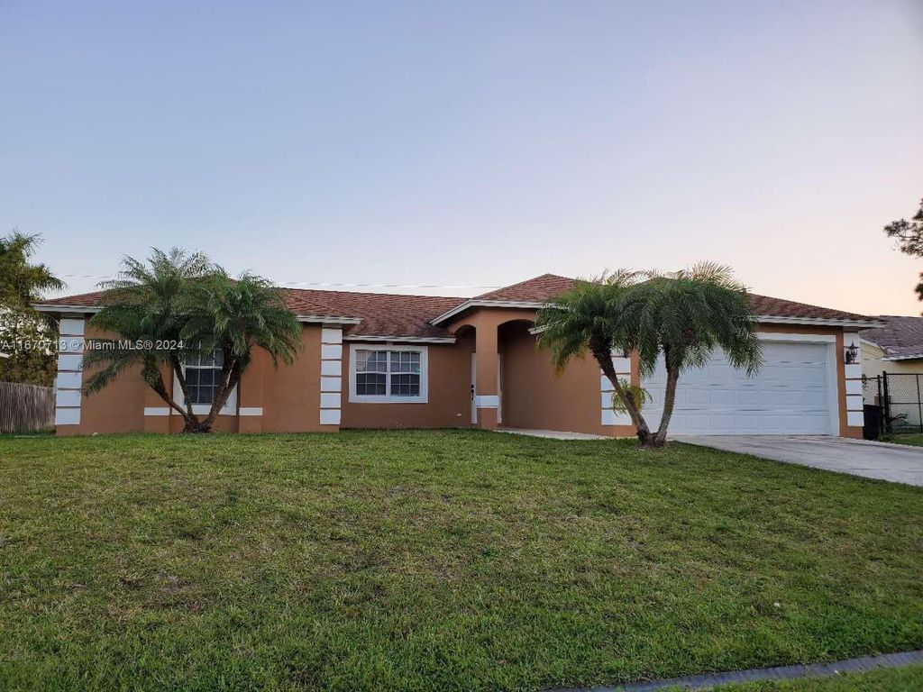 Photo of 1010 SW Mataro Ave, Port Saint Lucie, FL 34953 (MLS # A11670713)