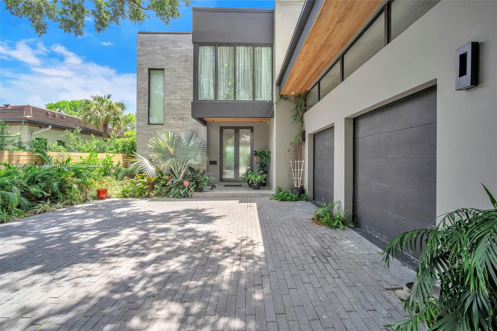 NEW ON THE MARKET! Stunning contemporary home built in 2018 on lushly landscaped 10,000 s.f. lot on a quiet street. Very spacious with elegant appointments. Huge state-of-the-art kitchen with top of the line appliances. Separate wet bar with wine cooler next to large family room. Beautiful outdoor entertainment area with built-in BBQ, bar sink and refrigerator adjacent to swimming pool. Five bedrooms plus den, 5 bathrooms plus 2 powder rooms. Huge master bedroom with walk-in closet with built-ins and terrace. Gorgeous master bathroom with tub/shower. One laundry room upstairs and one utility room with sink downstairs. 2-car air conditioned garage. A MUST SEE! WON’T LAST!