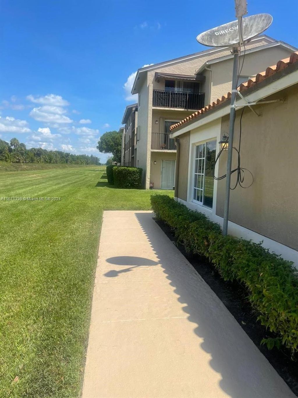 Photo of 1089 N Benoist Farms Rd #107, West Palm Beach, FL 33411 (MLS # A11671339)