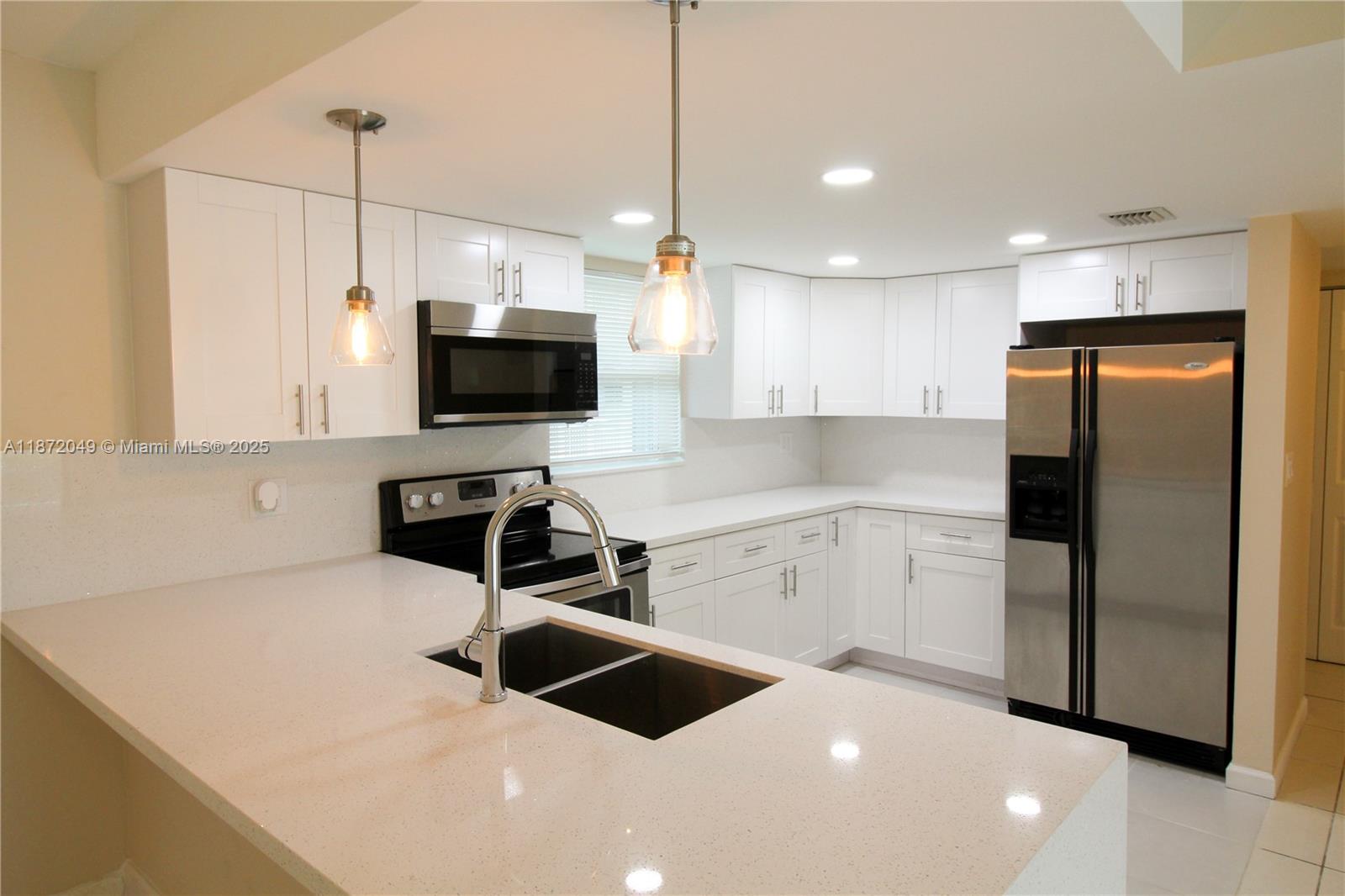 FONTAINEBLEAU WITH VIEWS OF THE LAKE - At The Beach Club Condo you have Large and wonderful apartment totally remodeled. 1 Bed, 1bath and a half. Open kitchen was totally remodeled and all appliances are new, washer and dryer inside plenty of storage. Spacious living/dining area and huge balcony with beautiful and serene views of the water from the living room. Complete Accordion Shutters. One large bedroom with a walk in closet and remodeled bath with shower. Tiled throughout. One parking spot assigned and generous guest parking. Well maintained Community located close to Miami International Airport, major highways (826, 836 & Turnpike) , schools, restaurants and shopping's.
